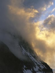 Raymond Gehman Clouds Obscure Mount Oberlin Along The Logan Pass