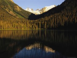 Raymond Gehman Snow Capped Mountains Reflect in a Lake